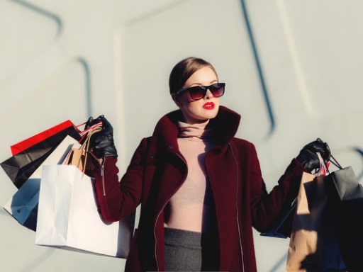 a styled women with red lips who is shopping
