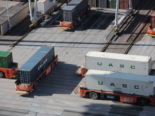 Automated Guided Vehicles carrying containers at Port of Rotterdam